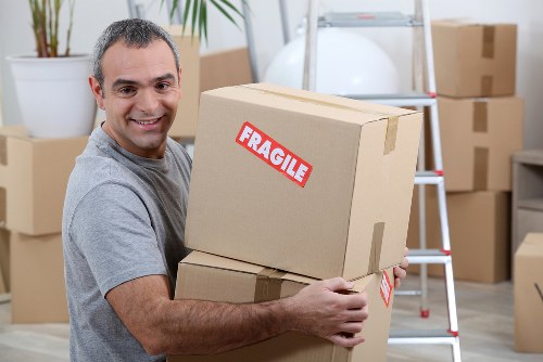 Man and van moving boxes in Docklands urban setting
