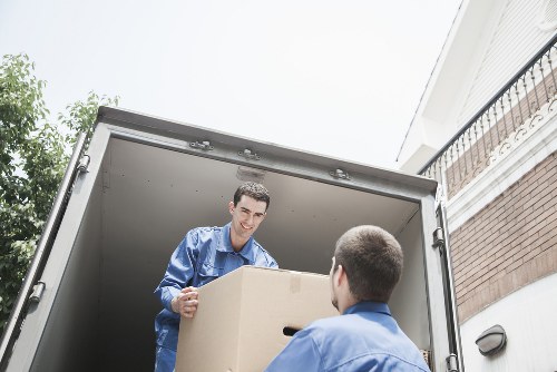 Worker assessing a moving route and handling risks before loading items
