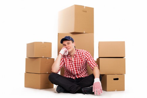 Professional packers organising fragile household items for transport