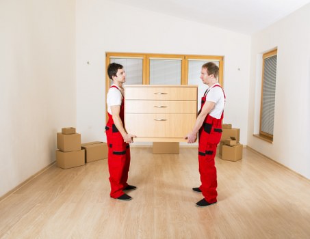 Organised office relocation with labelled boxes and transport equipment in Docklands